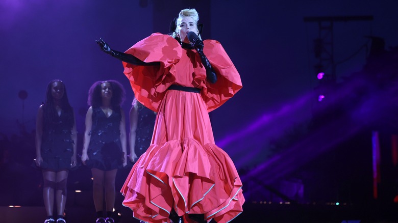 Paloma Faith in red dress performing 