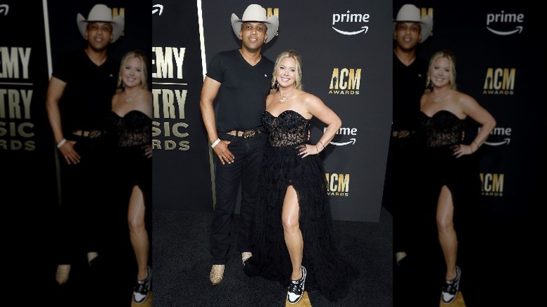 Coffey Anderson and Criscilla Crossland posing in all black on the red carpet