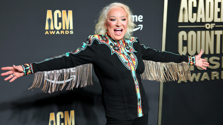 Tanya Tucker posing on ACM Awards red carpet