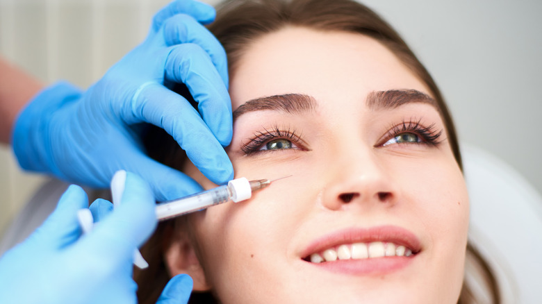 A woman getting under-eye fillers