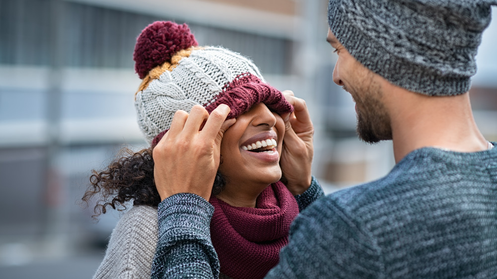 Couple laughing together outside