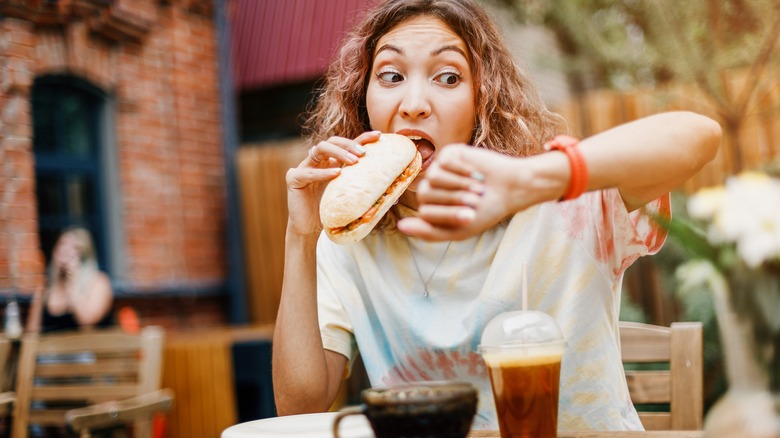 Woman eating in a rush