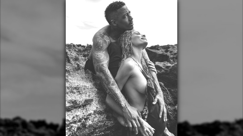 Nick Cannon and Alyssa Scott posing