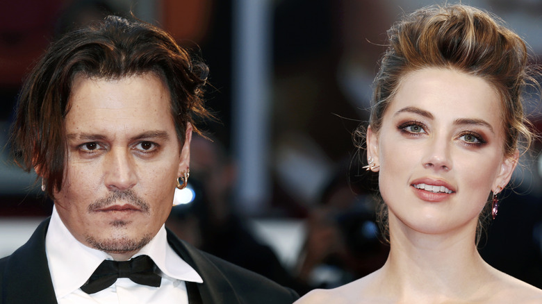 Johnny Depp and Amber Heard posing