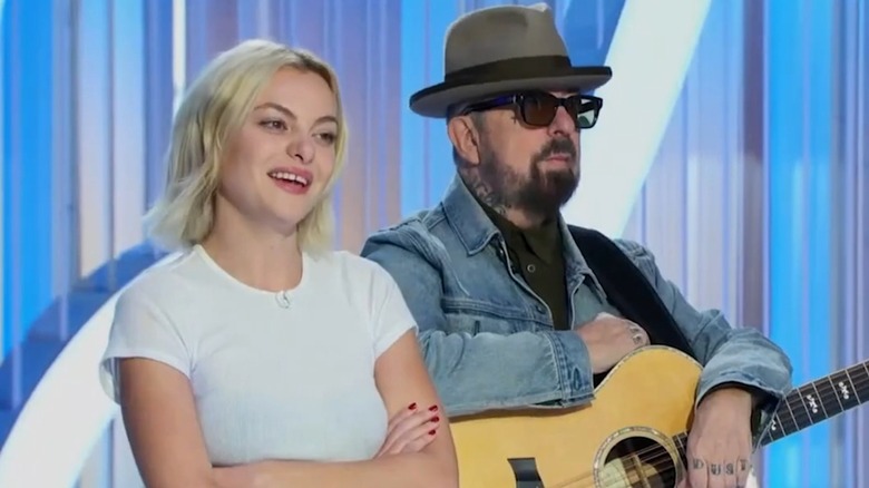 Kaya Stewart and her father Dave, who is holding a guitar