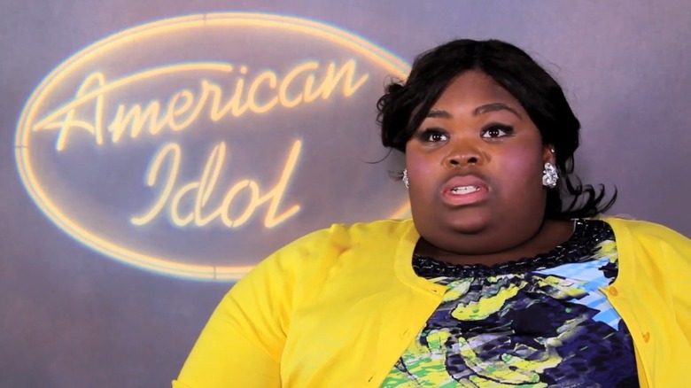 Tiquila Wilson in front of an American Idol logo