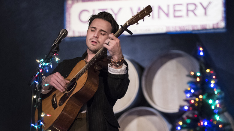 Kris Allen performing on stage