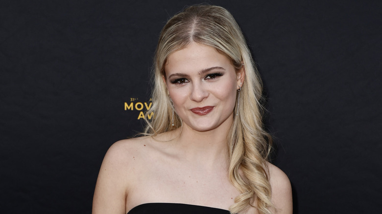 Darci Lynne Farmer smiling at an event in 2024.