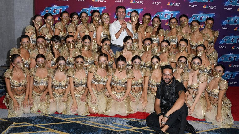 Nadim Cherfan (in black) with Simon Cowell and the Mayyas