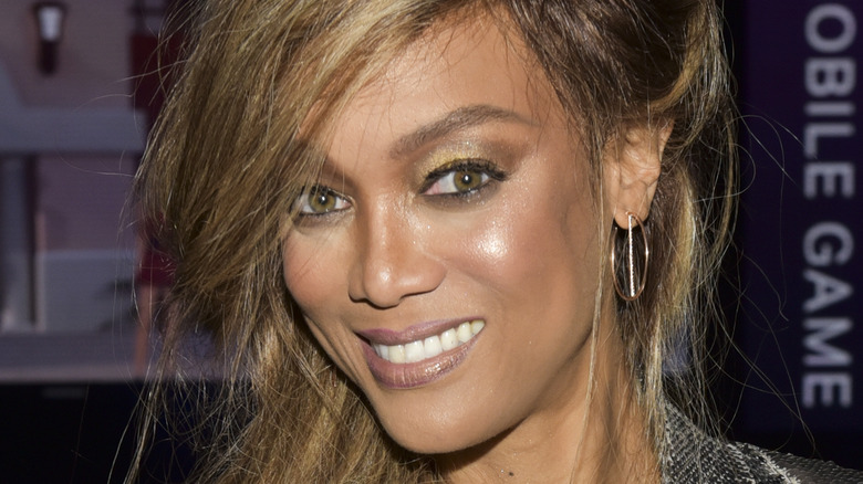 Tyra Banks smiles