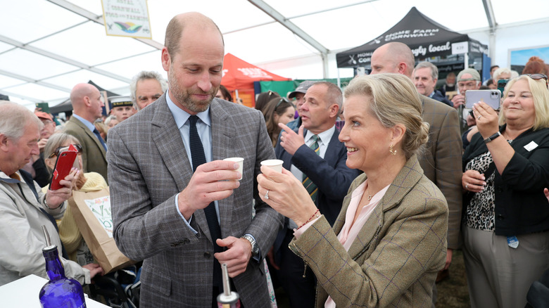 Prince William, Prince of Wales, also known as the Duke of Cornwall, and Sophie, Duchess of Edinburgh try local Gin as they attend the Royal Cornwall Show at the Royal Cornwall Showground on June 06, 2025 in Wadebridge, England.