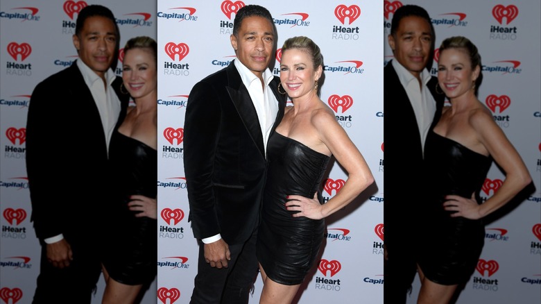 T.J. Holmes and AJ Robach posing in formalwear