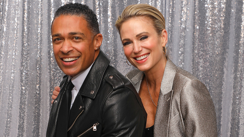 T.J. Holmes and Amy Robach smiling