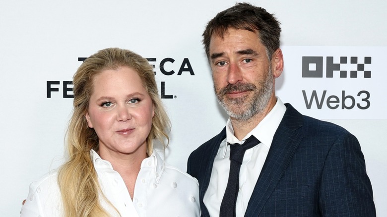 Amy Schumer and Chris Fischer attend the "Room To Move" premiere