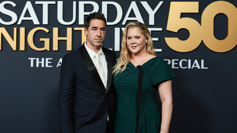 Amy Schumer and Chris Fischer attend an SNL event