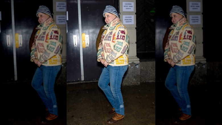 Amy Schumer in a quilted jacket and jeans