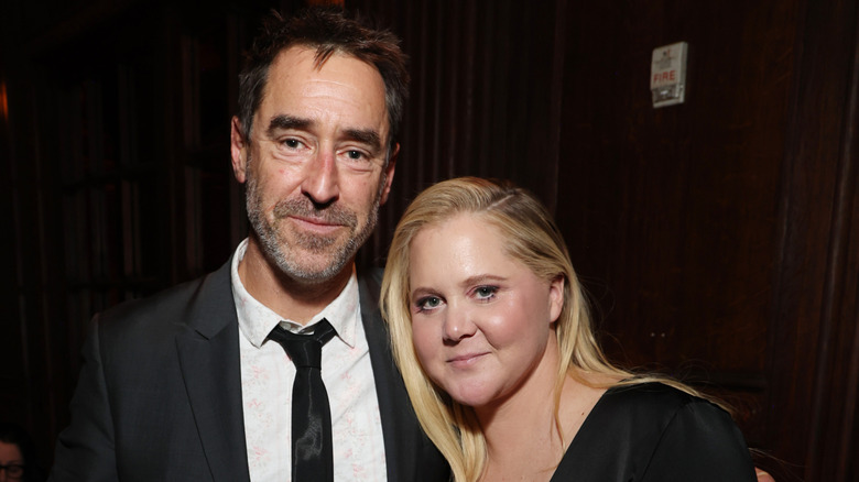 Chris Fischer and Amy Schumer smiing