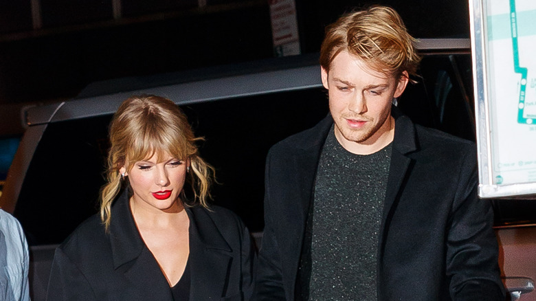 Joe Alwyn and Taylor Swift walking