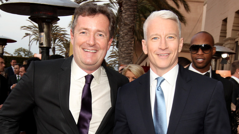 Piers Morgan posing with Anderson Cooper