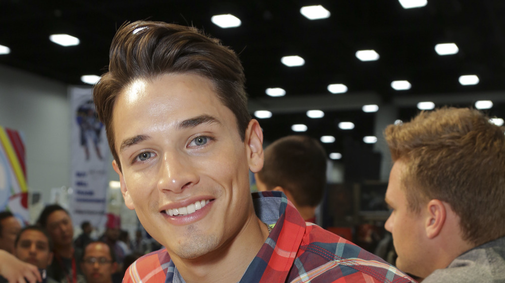 Bling Empire's Andrew Gray smiles 