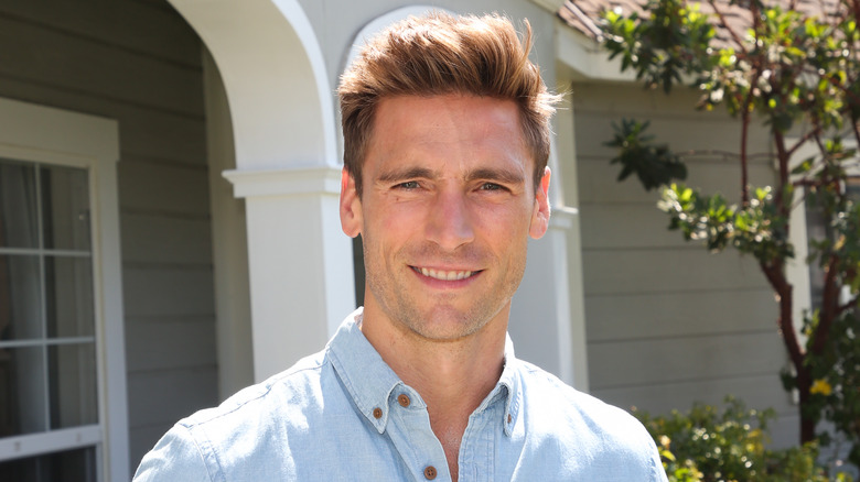 Andrew Walker smiling in an outdoor setting