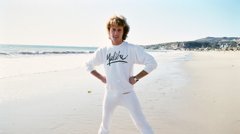 Andy Gibb posing in all white on Malibu beach, circa 1982