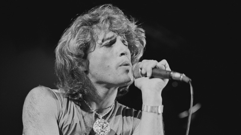 Black and white photo of Andy Gibb performing in 1979