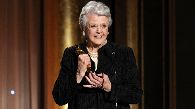 Angela Lansbury holding an Oscar