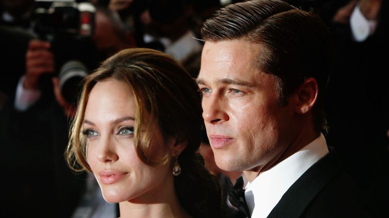 Angelina Jolie and Brad Pitt posing