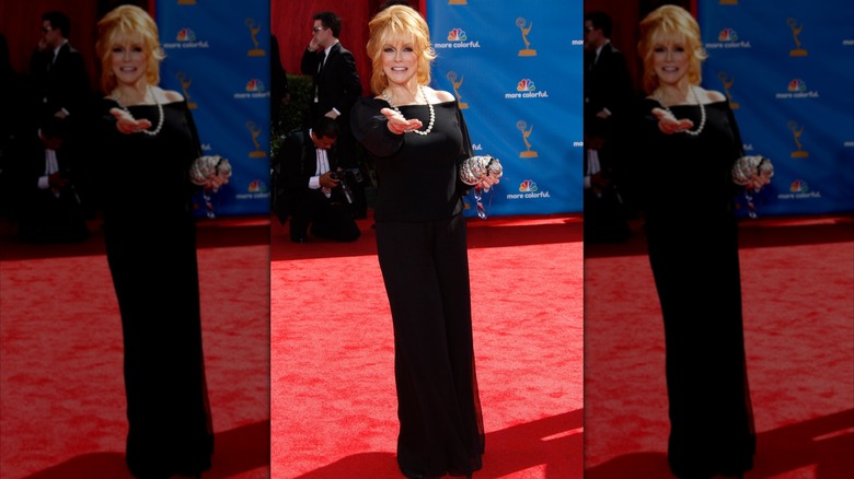 Ann-Margret in a black gown with silver necklace
