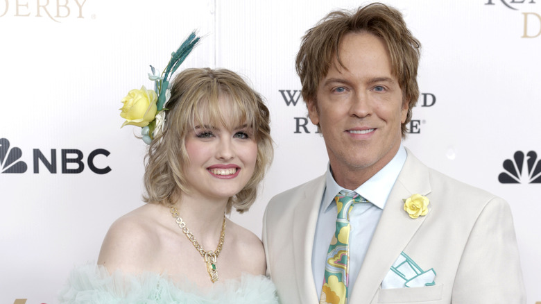 Dannielynn and Larry Birkhead smiling at the Kentucky Derby in 2025