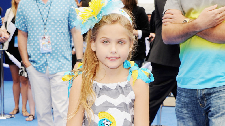 Larry and Dannielynn Birkhead smiling at the premiere of "Smurfs 2" in 2013