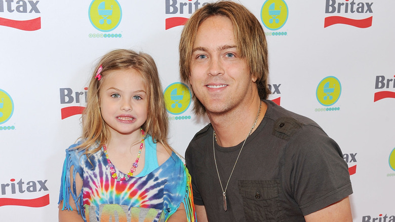 Dannielynn and Larry Birkhead smiling at the launch of The Britax Baby Carrier in 2011
