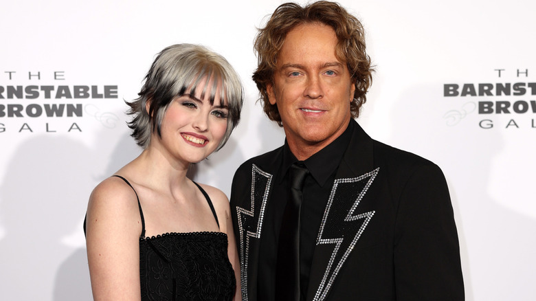 Dannielynn Birkhead and Larry Birkhead smiling and posing.