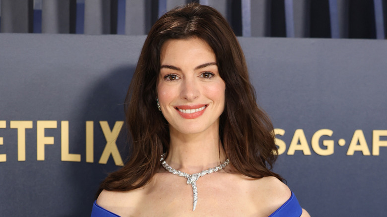 Anne Hathaway wearing a diamond necklace at the 30th Annual Screen Actors Guild Awards