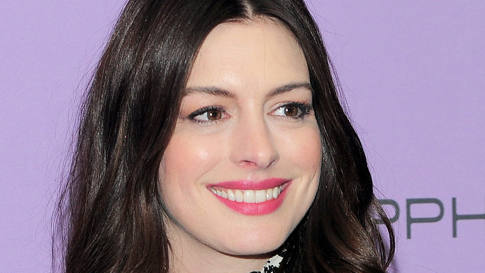 Anne Hathaway purple background