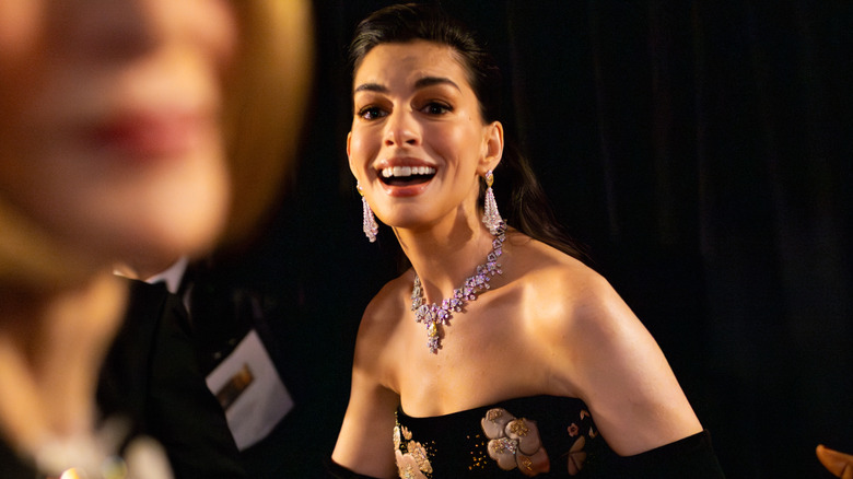 Anne Hathaway laughing