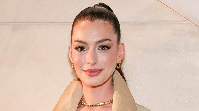 Anne Hathaway poses at a 2025 Ralph Lauren show