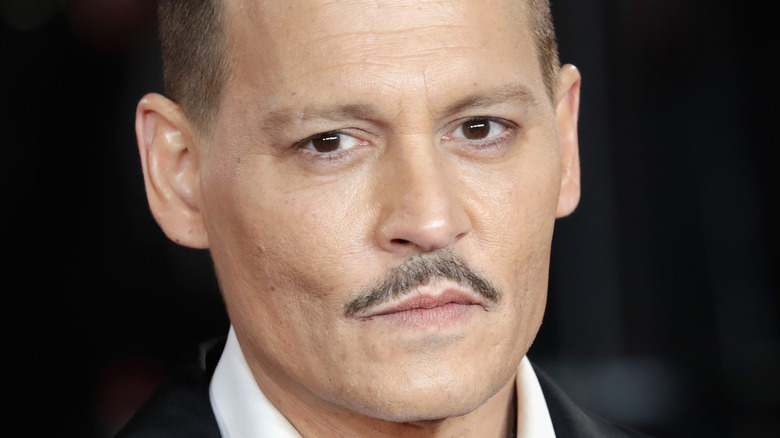 Johnny Depp attends an event with a moustache