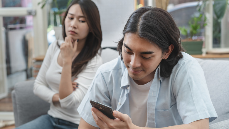 woman suspicious of man