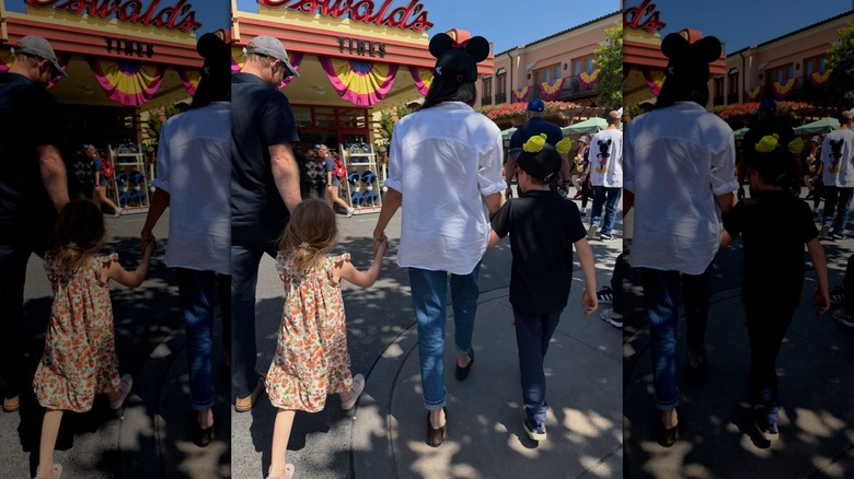 Prince Harry and Meghan Markle walking with Prince Archie and Princess Lilibet