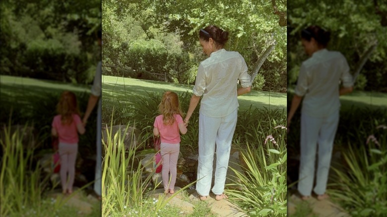 Meghan Markle holding hands with Princess Lilibet in California