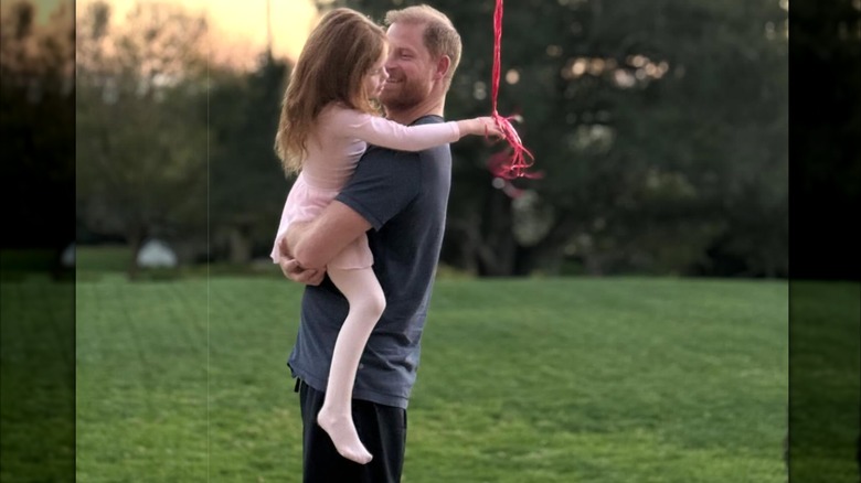 Prince Harry hugging Princess Lilibet