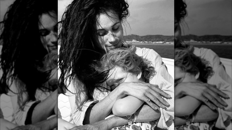 Meghan Markle hugs Princess Lilibet on a boat
