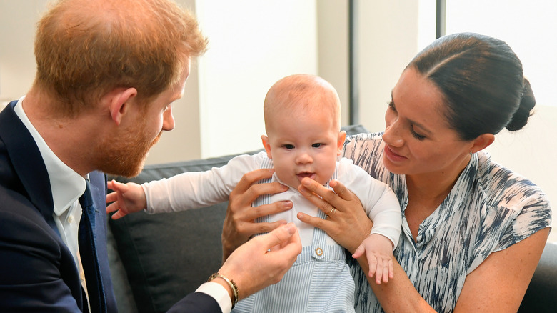 Prince Harry, Prince Archie, and Meghan Markle traveling in Africa