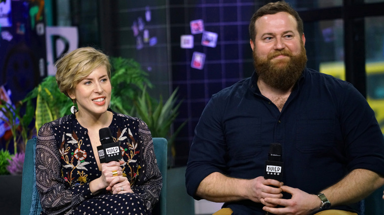 Erin and Ben Napier sitting on chairs with microphones