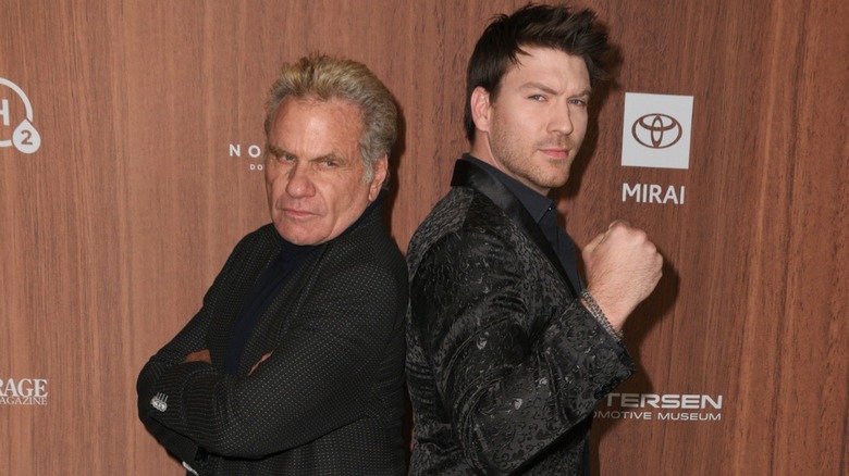 Martin Kove and Jesse Kove standing back-to-back