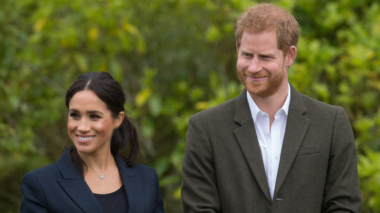 Prince Harry and Meghan Markle smiling