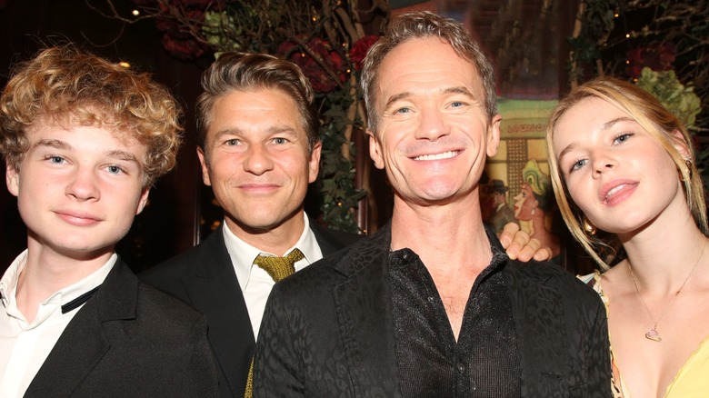 Gideon Burtka-Harris, David Burtka, Neil Patrick Harris and Harper Burtka-Harris smiling.