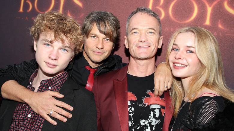 Gideon Burtka-Harris, David Burtka, Neil Patrick Harris and Harper Burtka-Harris posing at The Lost Boys premiere.